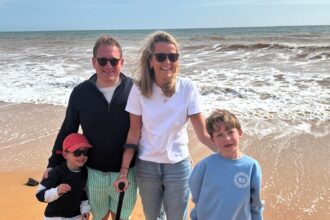 Amelia Peckham, a disabled mum once called selfish for having kids, proudly books summer off to be with her sons - proving her critics wrong with love and presence.