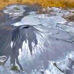 A 60cm mud volcano dubbed the world’s smallest has emerged in a Peruvian village, sparking intrigue and environmental concern as experts investigate its unusual activity.