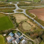 Castilly Henge, a 5,000-year-old ritual site near Bodmin, faces threats from invasive plants and nearby development as a £50,000 appeal seeks to save its sacred history.