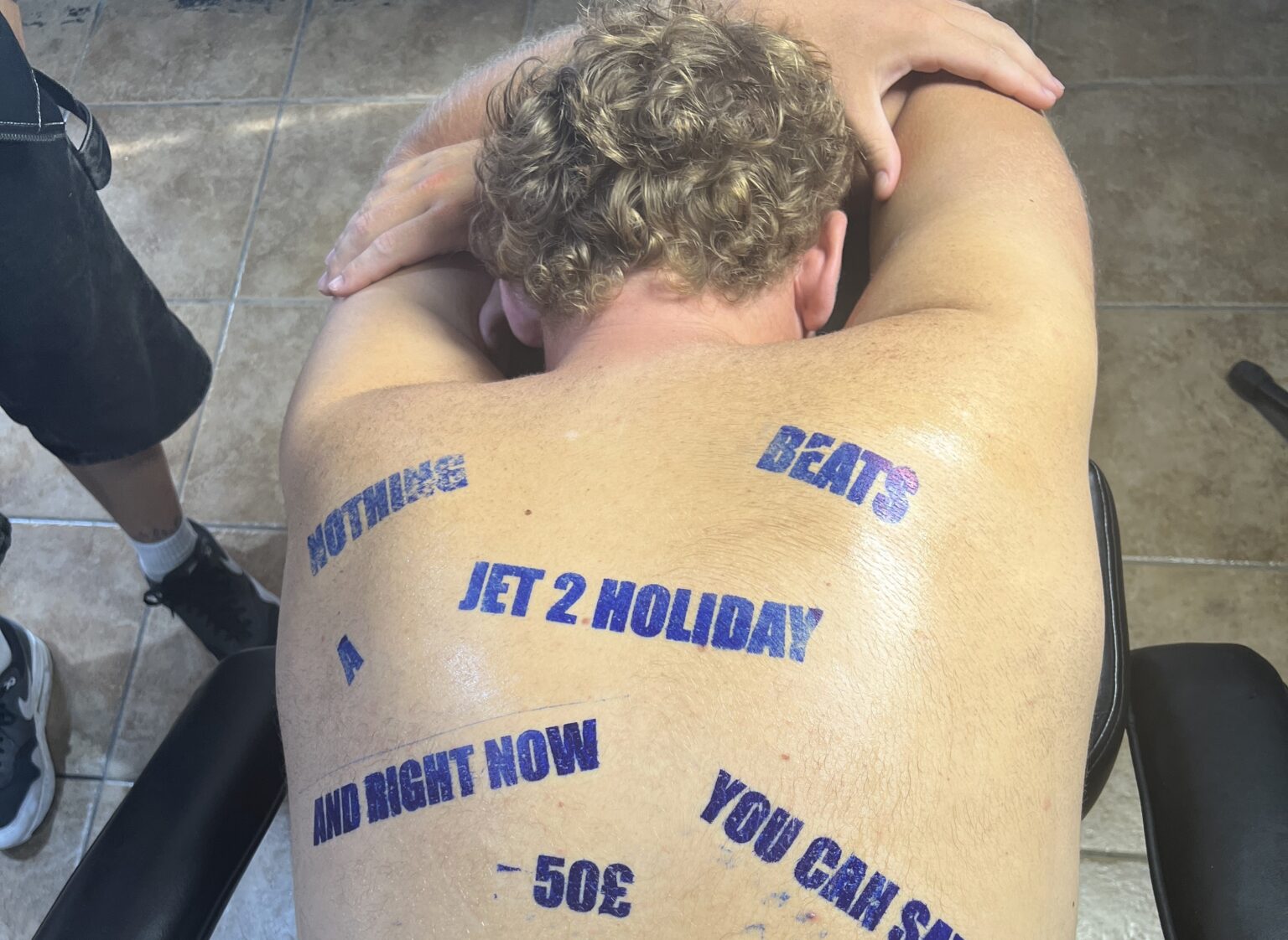 Brit fakes viral “Jet2holiday” tattoo in Greece as prank inspired by TikTok trend – clip hits 49.4M views with fans shocked until tattoo shop reveals it was all staged.