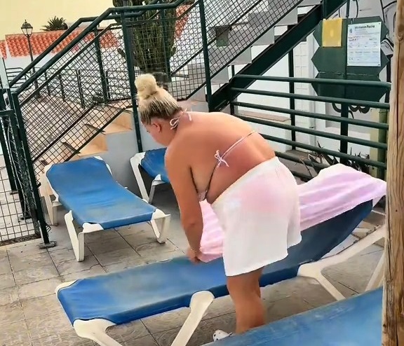 Mum-of-six sparks outrage by reserving nine sunbeds before breakfast on family holiday in Fuerteventura as furious Brits slam her controversial poolside tactic.