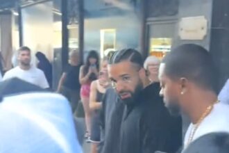 Drake spotted shopping at Harrods before Wireless show - fans catch rapper in all black on Knightsbridge escalators and outside store ahead of headline gig.