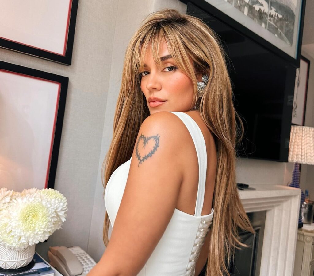 A dancing diva stole the spotlight at Madrid Pride, grooving in ankle-deep rain as the crowd roared - her joyful moves upstaged no-show star Karol G in a viral moment.