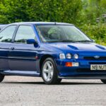 A rare 1996 Ford Escort RS Cosworth Lux with just 22,744 miles and one owner is up for auction at £90,000, boasting 150mph performance and collector appeal.