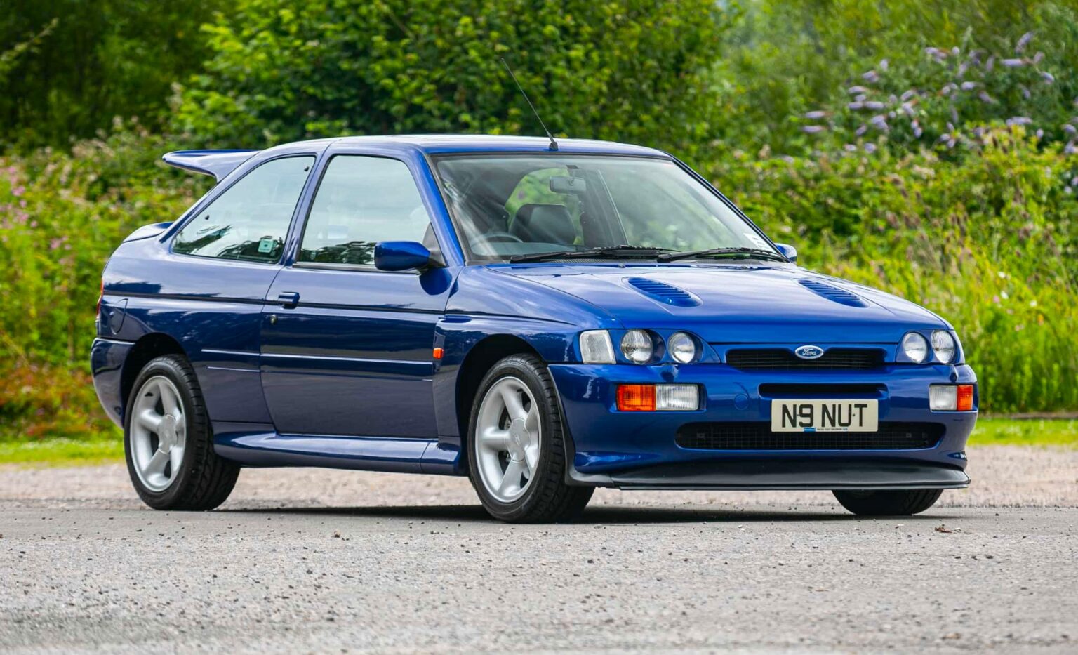 A rare 1996 Ford Escort RS Cosworth Lux with just 22,744 miles and one owner is up for auction at £90,000, boasting 150mph performance and collector appeal.