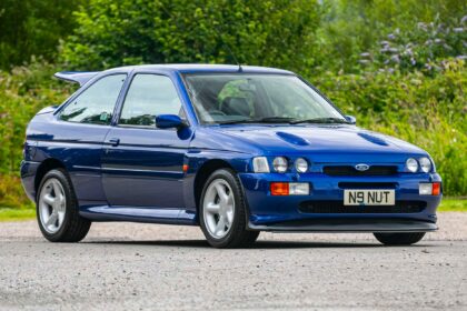 A rare 1996 Ford Escort RS Cosworth Lux with just 22,744 miles and one owner is up for auction at £90,000, boasting 150mph performance and collector appeal.