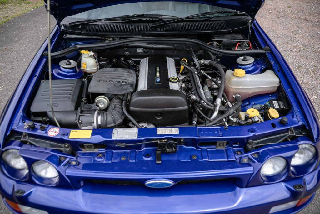 A rare 1996 Ford Escort RS Cosworth Lux with just 22,744 miles and one owner is up for auction at £90,000, boasting 150mph performance and collector appeal.