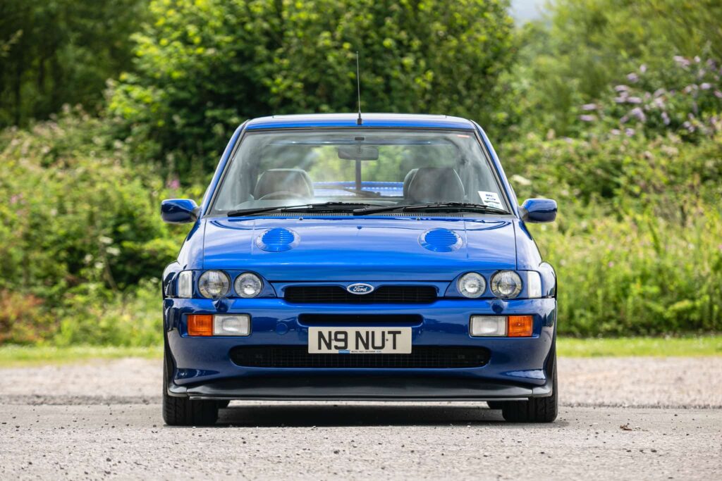 A rare 1996 Ford Escort RS Cosworth Lux with just 22,744 miles and one owner is up for auction at £90,000, boasting 150mph performance and collector appeal.