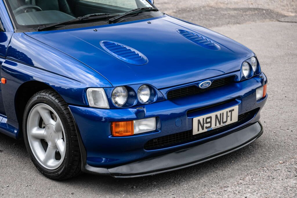 A rare 1996 Ford Escort RS Cosworth Lux with just 22,744 miles and one owner is up for auction at £90,000, boasting 150mph performance and collector appeal.