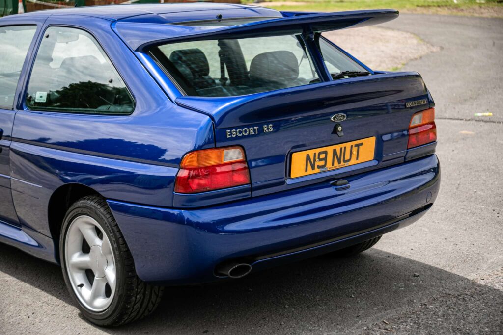 A rare 1996 Ford Escort RS Cosworth Lux with just 22,744 miles and one owner is up for auction at £90,000, boasting 150mph performance and collector appeal.