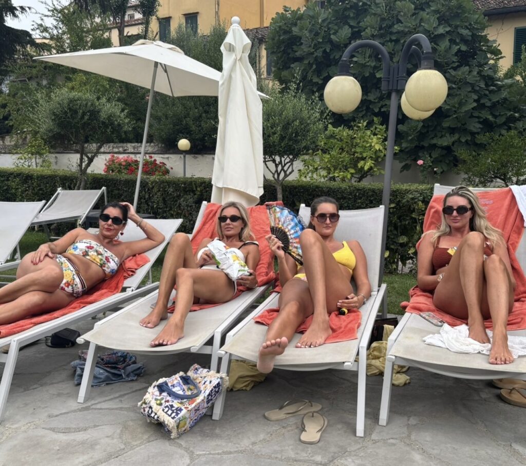 Four sisters flew to Italy for a birthday trip only to find their hotel booking was for 2026, ending up in a hot basement room but laughing through the unexpected adventure.