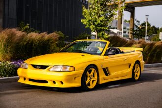 George Foreman’s 1995 Saleen Mustang, with only 728 miles and 510bhp, is up for sale at £9,300. This rare canary yellow convertible was rarely driven and heavily upgraded.