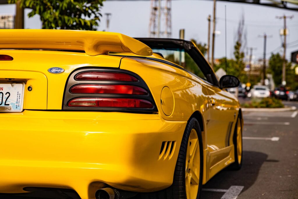 George Foreman’s 1995 Saleen Mustang, with only 728 miles and 510bhp, is up for sale at £9,300. This rare canary yellow convertible was rarely driven and heavily upgraded.