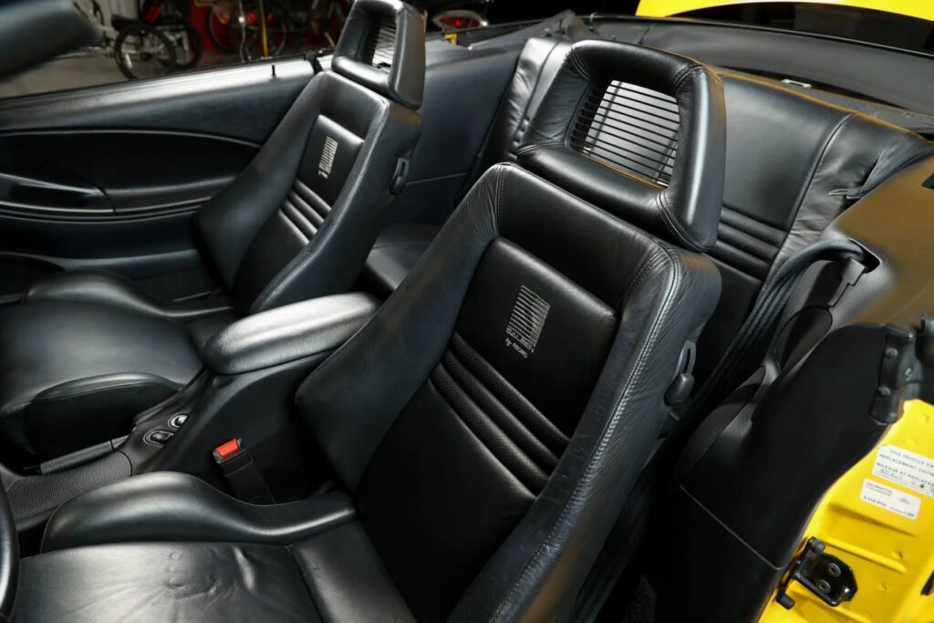 George Foreman’s 1995 Saleen Mustang, with only 728 miles and 510bhp, is up for sale at £9,300. This rare canary yellow convertible was rarely driven and heavily upgraded.