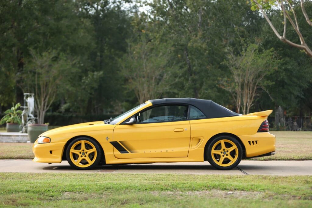 George Foreman’s 1995 Saleen Mustang, with only 728 miles and 510bhp, is up for sale at £9,300. This rare canary yellow convertible was rarely driven and heavily upgraded.