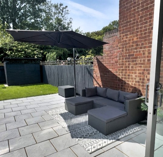 Single mum transforms garden for £1,127 using ChatGPT and grit after £10k quote - inspires kids and social media with DIY drive, ditching TV for power tools.