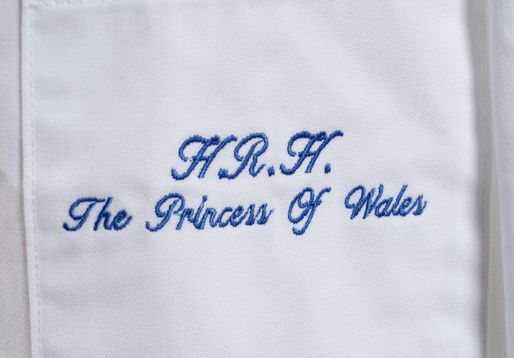 Princess Diana’s unwashed lab coat from a 1992 factory visit, left behind the day her separation was announced, has sold for £4,500 after decades hidden in a wardrobe.