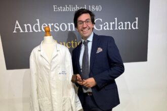 Princess Diana’s unwashed lab coat from a 1992 factory visit, left behind the day her separation was announced, has sold for £4,500 after decades hidden in a wardrobe.