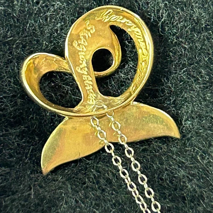 A thrift shopper scored big after buying a $1 whale tail pendant, later revealed to be 14k gold worth over $340 and designed by Alaskan artist Ralph Gorichanaz.