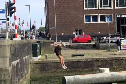Parkour star Noa Diorgina Man goes viral after falling into Rotterdam river during a water challenge, with fans praising her grace and asking about her stylish outfit.