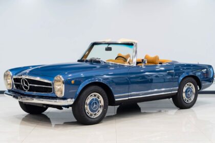 A vintage 1969 Mercedes-Benz 280SL once owned by Vasco Gucci is for sale at £85,000, featuring luxe cognac leather, low mileage, and a Gucci bag for the winning bidder.