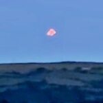 Mysterious multicoloured UFO stuns witness in Cornwall - filmed silently hovering and splitting into lights over the Tamar estuary before drifting away into the night.