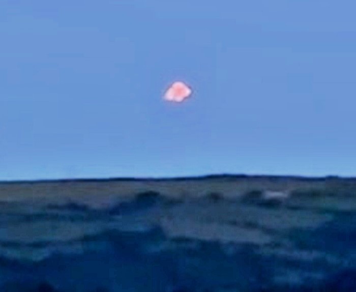Mysterious multicoloured UFO stuns witness in Cornwall - filmed silently hovering and splitting into lights over the Tamar estuary before drifting away into the night.