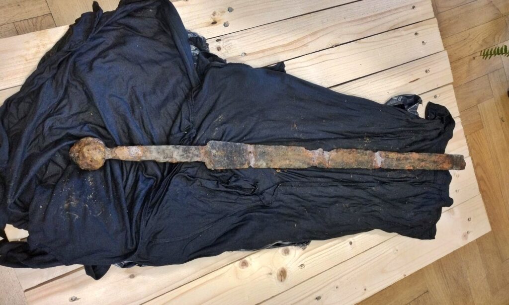 A fisherman stumbled upon a medieval sword possibly linked to the Knights Templar in Warsaw’s Vistula River - experts now analyzing the rare, centuries-old artefact.