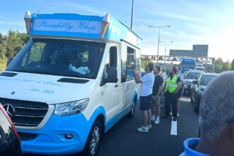 M25 drivers stuck in 30C heatwave treated to ice cream as van opens for business during jam - Piccadilly Whip praised for turning traffic chaos into a sweet success.