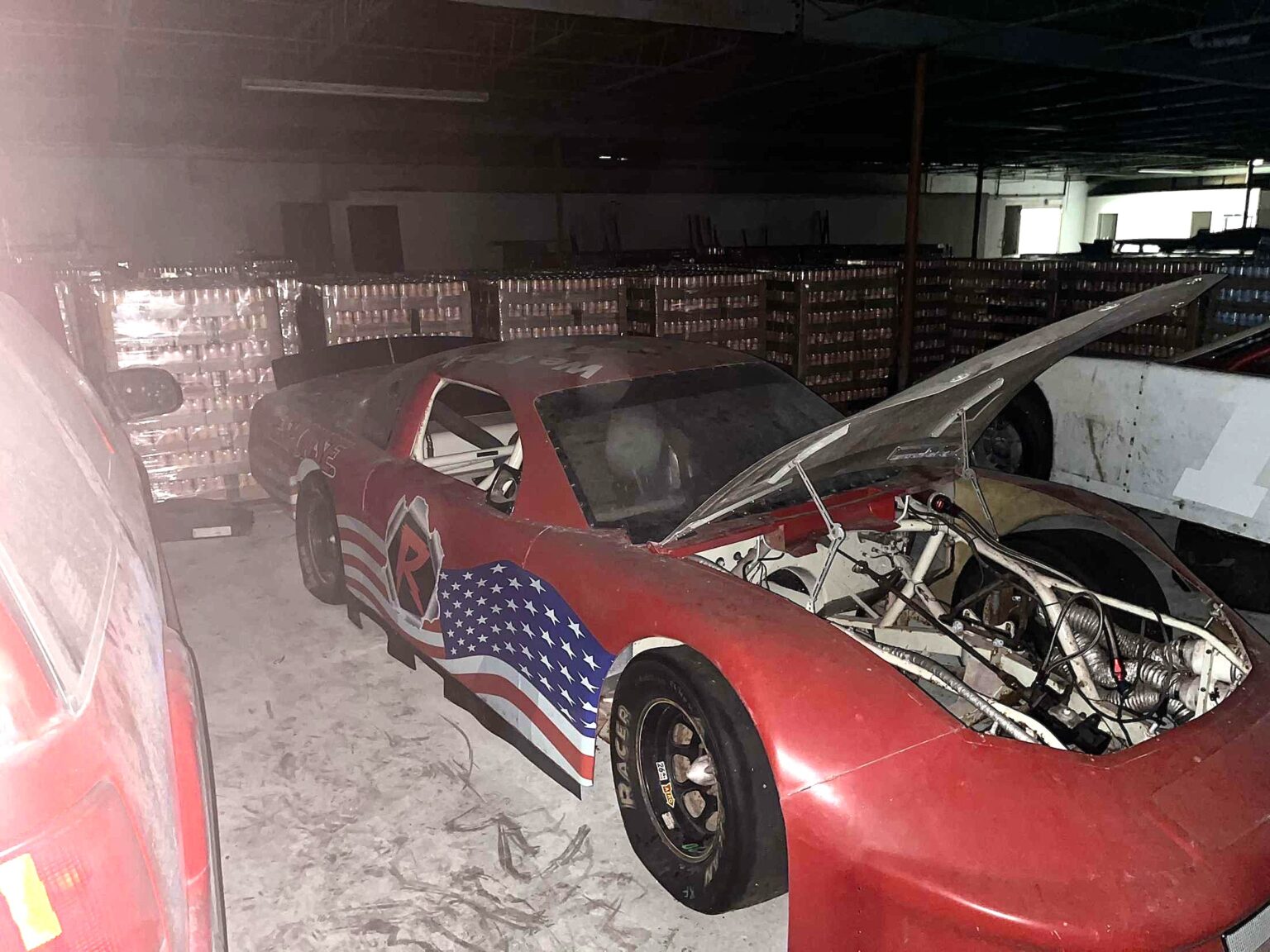 Teen urban explorer Jonathan found an abandoned warehouse near Tennessee filled with NASCAR cars and unopened energy drinks - a viral TikTok discovery worth thousands.
