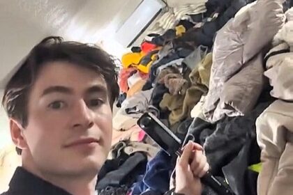 Tourist shocked by chaotic thrift market in Hanoi with mountains of clothes stacked to the ceiling - viral video sparks concerns over hygiene and safety risks.