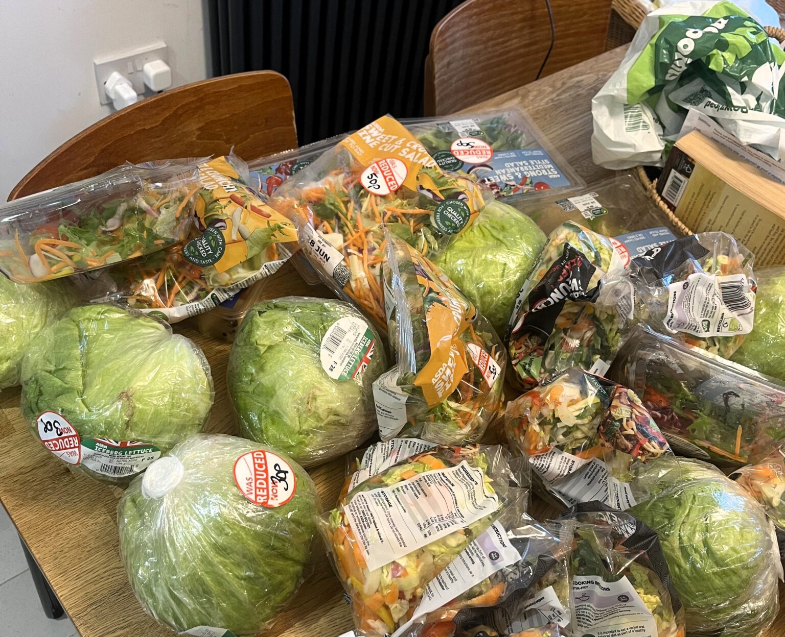 Woman stunned after Too Good To Go haul from Asda includes 7 lettuces and 13 salad bags, leaving her kitchen overrun and prompting doubts about using the app again.