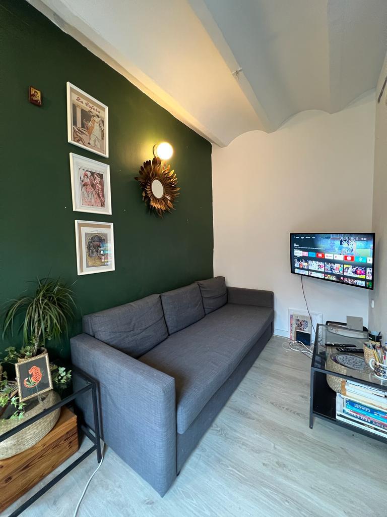 Tired of high rent, travel writer Karolina Wachowicz buys €180k beachfront flat in Barcelona, saying it's cheaper and easier than renting with monthly costs halved.