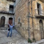 Woman buys 600-year-old Italian home for £22k after escaping sky-high LA rents - renovates 17-room medieval house in Sicily to build a peaceful, soulful life abroad.