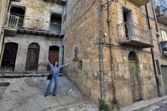Woman buys 600-year-old Italian home for £22k after escaping sky-high LA rents - renovates 17-room medieval house in Sicily to build a peaceful, soulful life abroad.