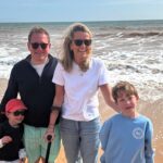 Amelia Peckham, a disabled mum once called selfish for having kids, proudly books summer off to be with her sons - proving her critics wrong with love and presence.