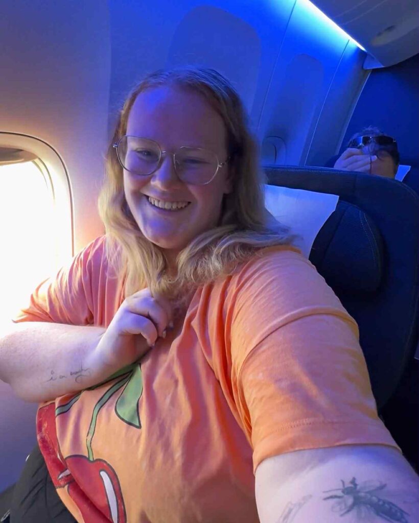 Plus-size travel blogger Kirsty Leanne defends not booking two plane seats, citing airline confusion and cost, while facing daily trolling and launching her own travel brand.