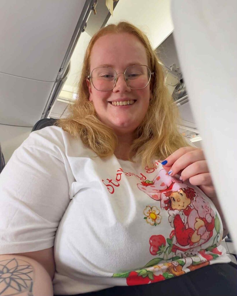 Plus-size travel blogger Kirsty Leanne defends not booking two plane seats, citing airline confusion and cost, while facing daily trolling and launching her own travel brand.
