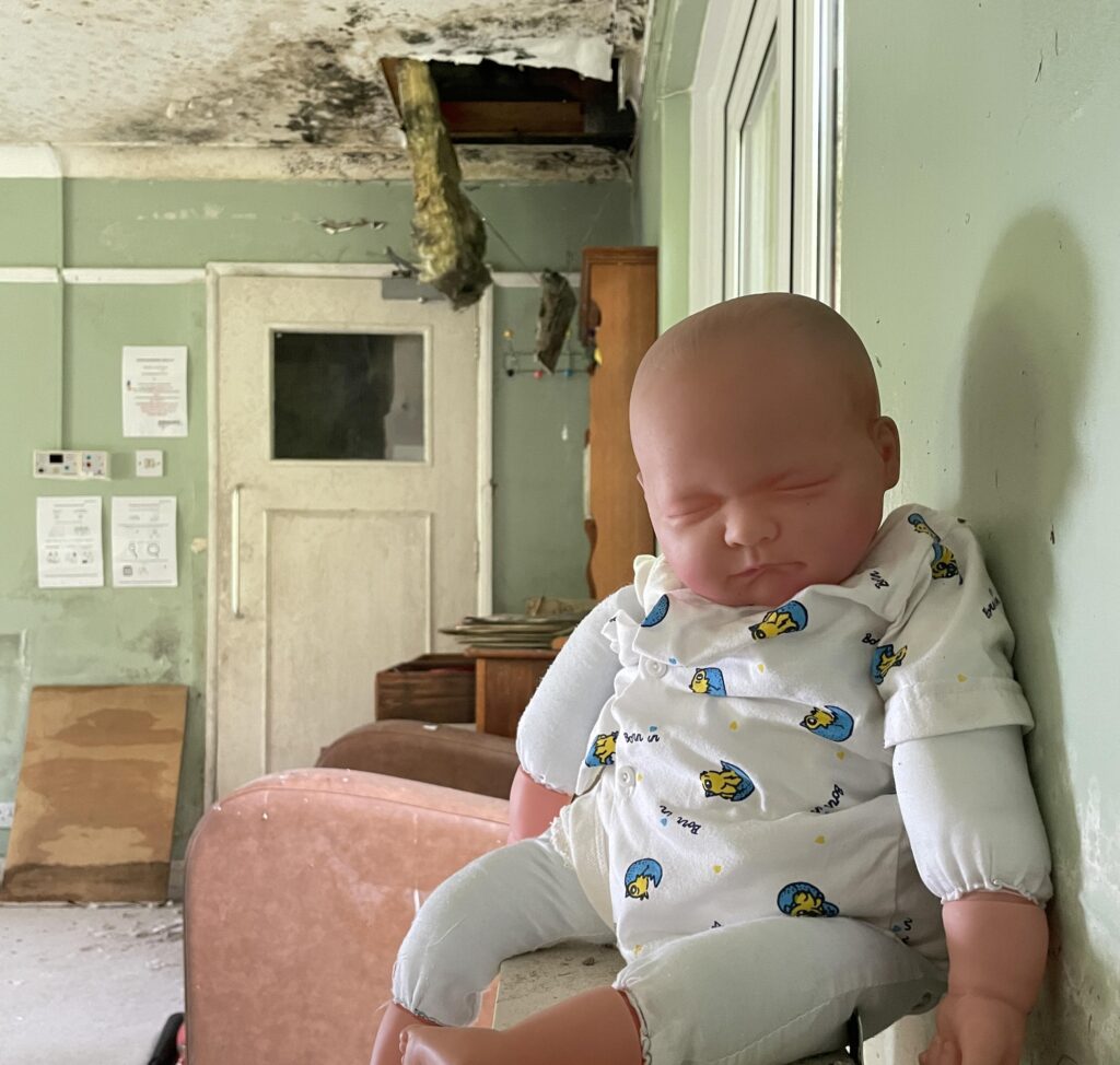Urban explorer finds eerie abandoned care home in East Sussex with mouldy photos, baby dolls and rotting furniture left behind after closing its doors in 2020.