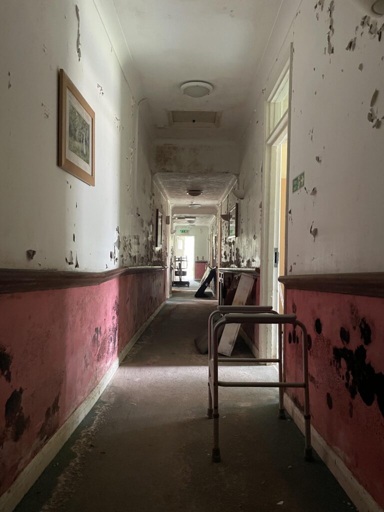 Urban explorer finds eerie abandoned care home in East Sussex with mouldy photos, baby dolls and rotting furniture left behind after closing its doors in 2020.