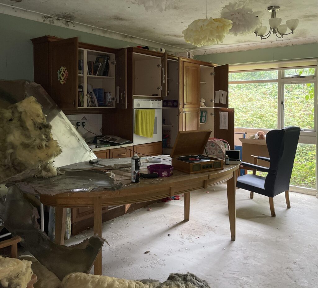Urban explorer finds eerie abandoned care home in East Sussex with mouldy photos, baby dolls and rotting furniture left behind after closing its doors in 2020.