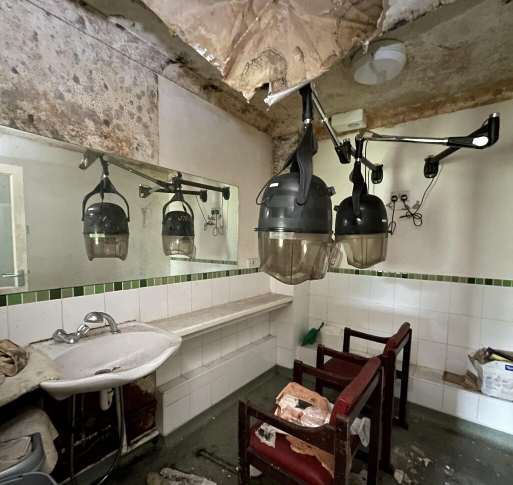 Urban explorer finds eerie abandoned care home in East Sussex with mouldy photos, baby dolls and rotting furniture left behind after closing its doors in 2020.