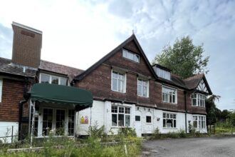 Urban explorer finds eerie abandoned care home in East Sussex with mouldy photos, baby dolls and rotting furniture left behind after closing its doors in 2020.