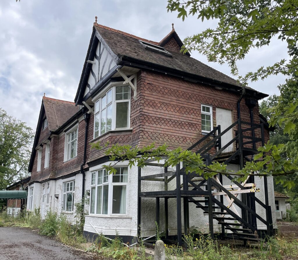 Urban explorer finds eerie abandoned care home in East Sussex with mouldy photos, baby dolls and rotting furniture left behind after closing its doors in 2020.