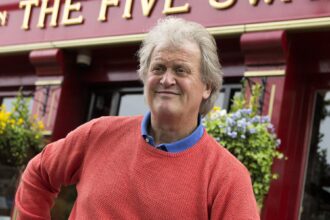 Wetherspoons boss Sir Tim Martin reinstates tuna jacket potato after angry customer complains about missing filling at Guildford pub prompting swift menu U-turn.