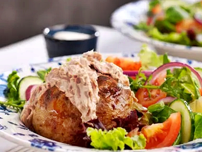 Wetherspoons boss Sir Tim Martin reinstates tuna jacket potato after angry customer complains about missing filling at Guildford pub prompting swift menu U-turn.
