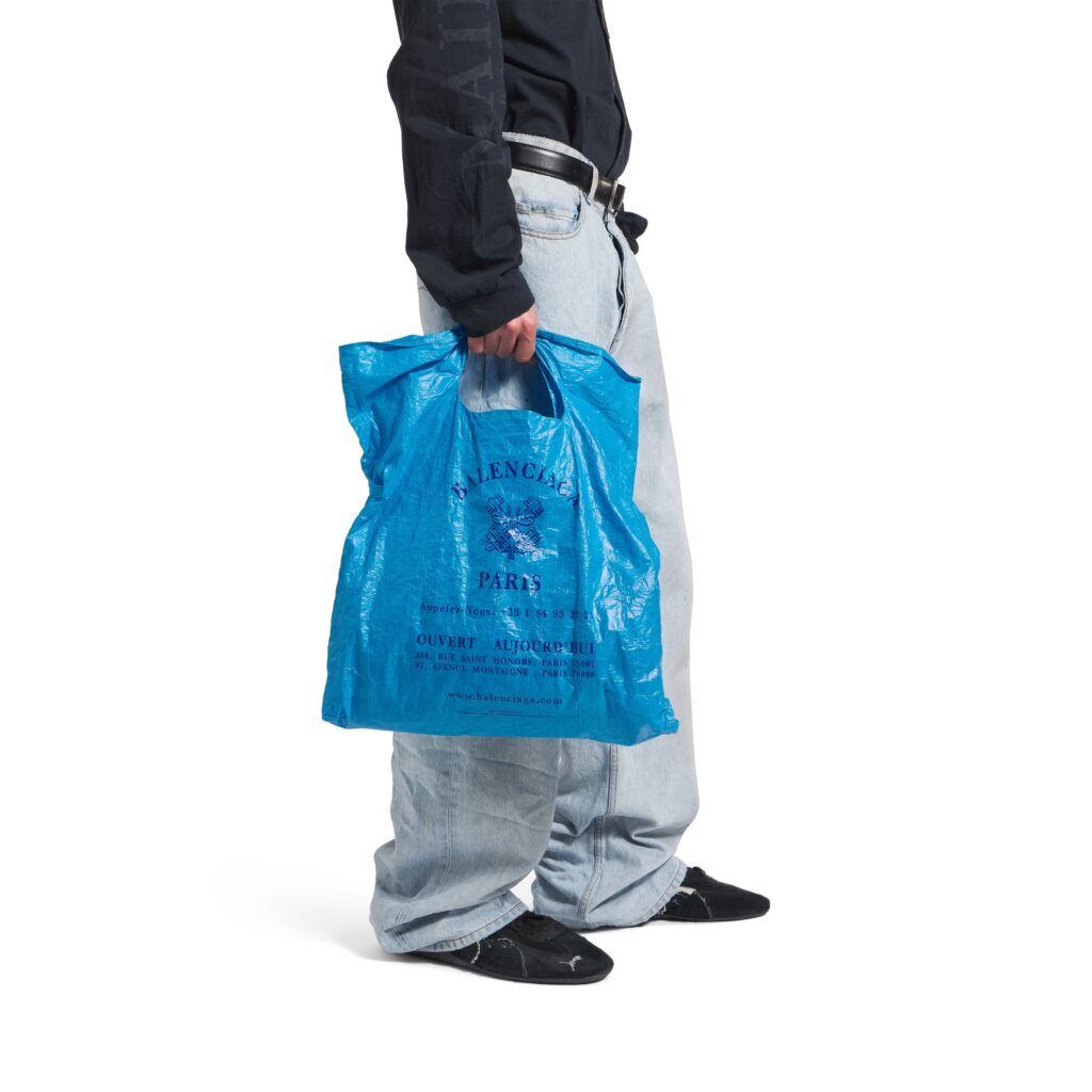 Balenciaga’s £775 Marché Packable Tote mimics a worn supermarket bag with crinkles, Paris store details and Italian craftsmanship, sparking debate over luxury pricing.