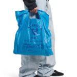 Balenciaga’s £775 Marché Packable Tote mimics a worn supermarket bag with crinkles, Paris store details and Italian craftsmanship, sparking debate over luxury pricing.