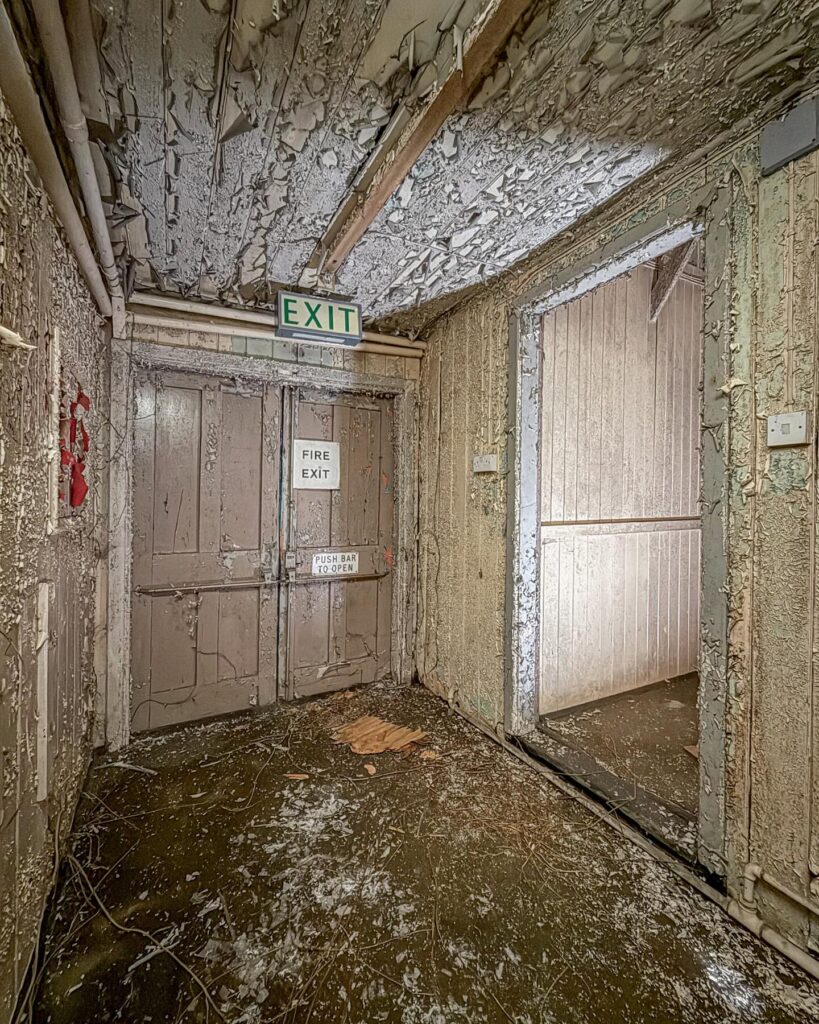British explorer Chloe Urbex uncovers “super creepy” abandoned MOD barracks in London left to rot for 50 years - eerie photos reveal peeling walls, decayed halls and old signs.