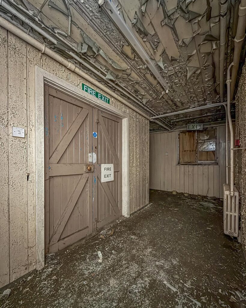 British explorer Chloe Urbex uncovers “super creepy” abandoned MOD barracks in London left to rot for 50 years - eerie photos reveal peeling walls, decayed halls and old signs.